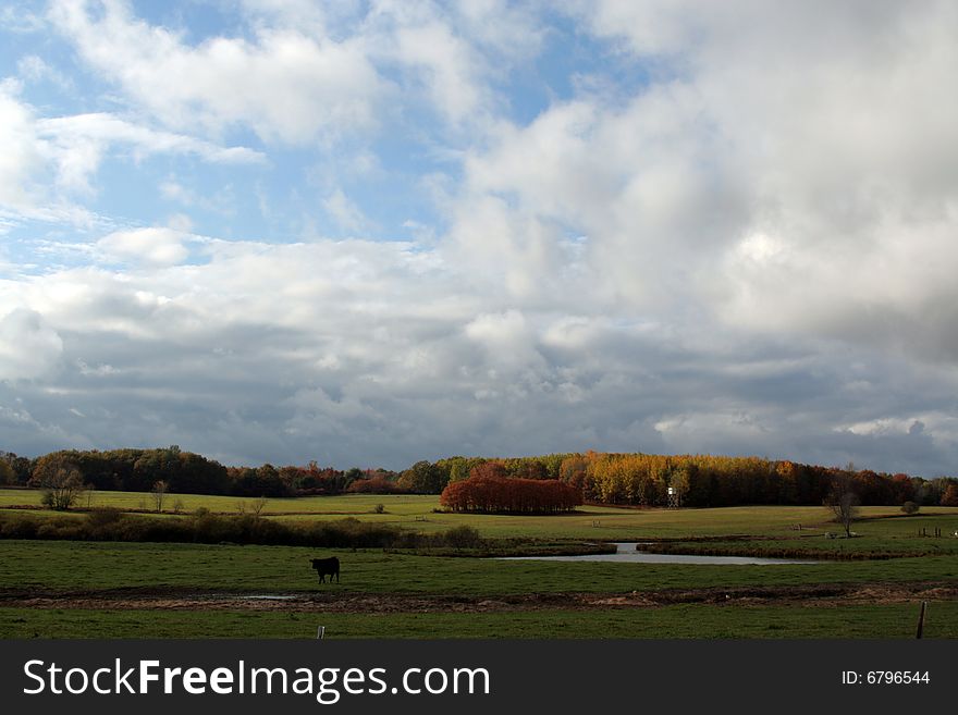 Clouds over a farm pasture in October. Clouds over a farm pasture in October
