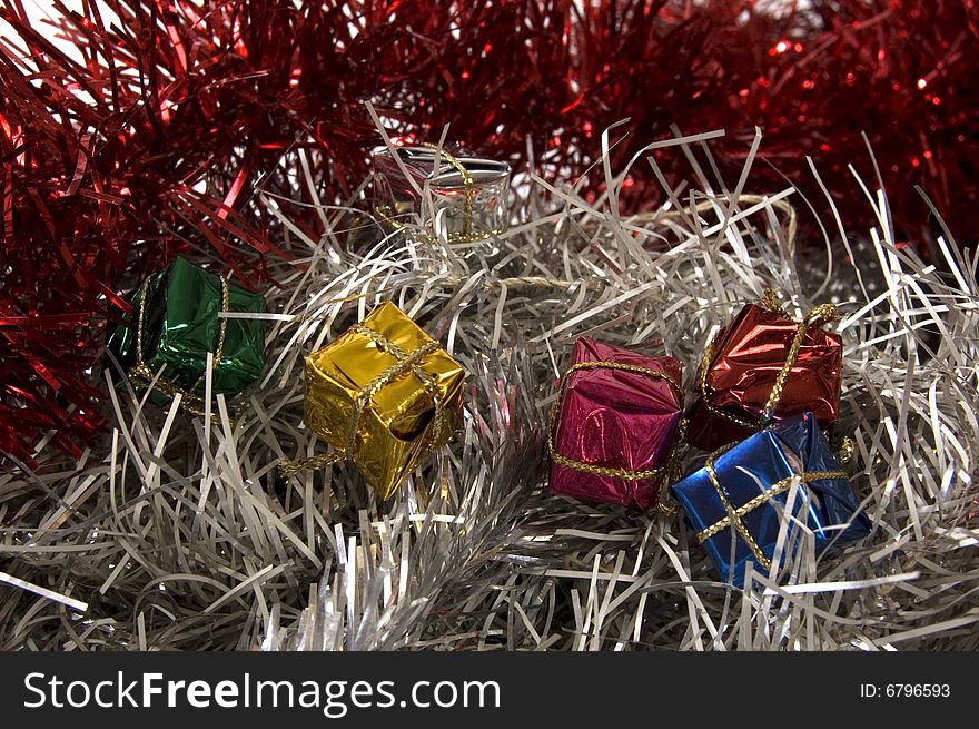 Christmas decoration with small presents on red and silver