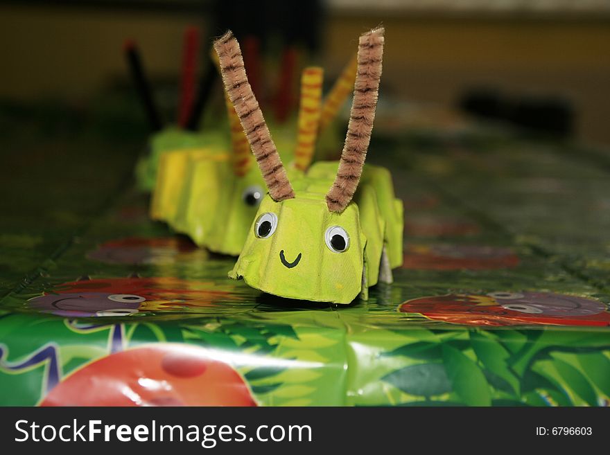 Childs party table decorated with a catepiller