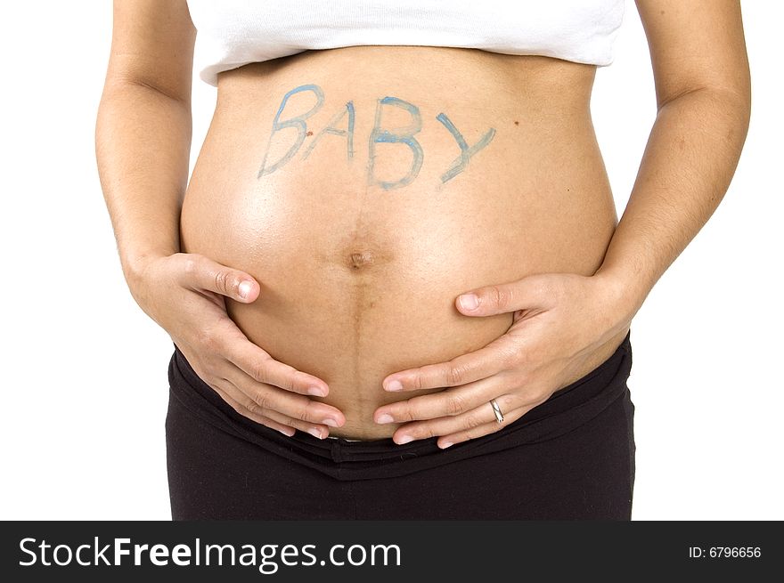 30 weeks pregnant teenager holding her belly with the word baby