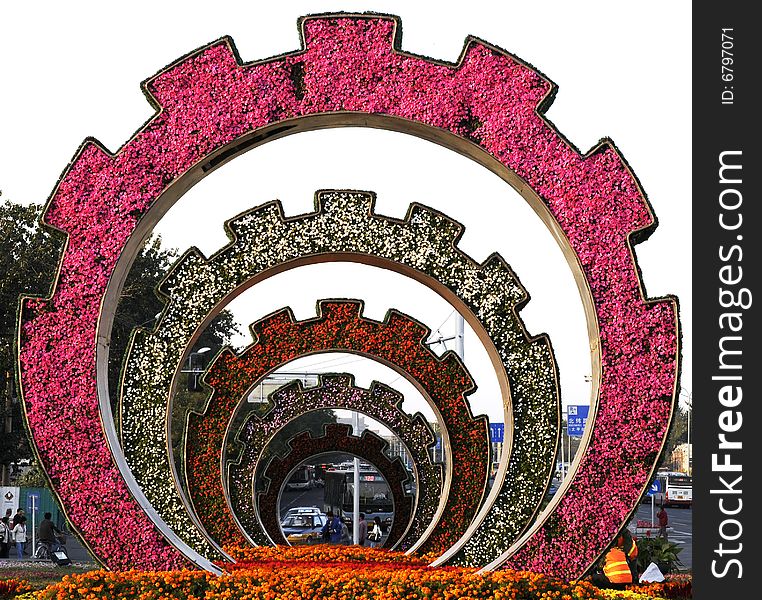 Gardening with flowers, city sculpture with colorful flower