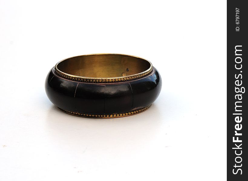 Shot of a brown bangle on a white background