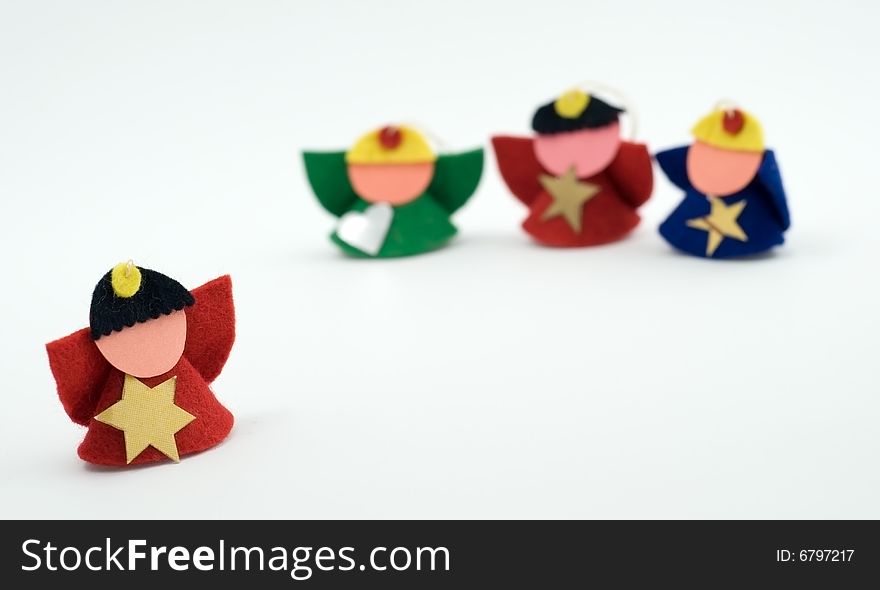 Four christmas figurines on the white background