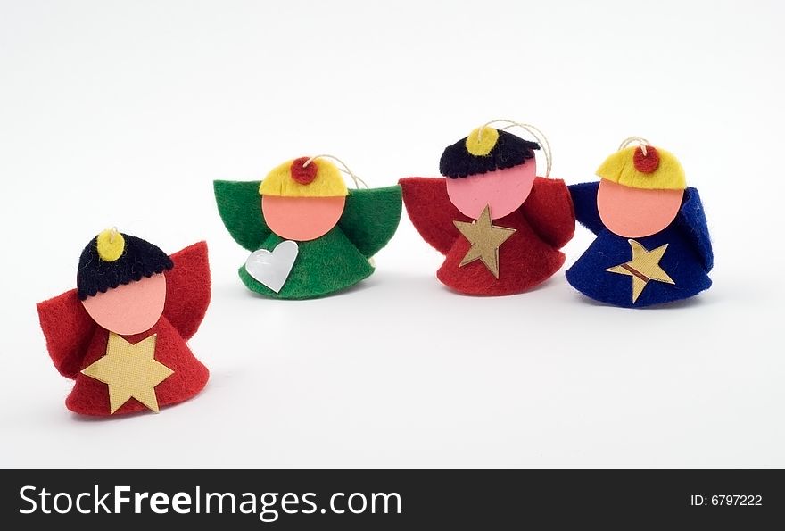 Four christmas figurines on the white background