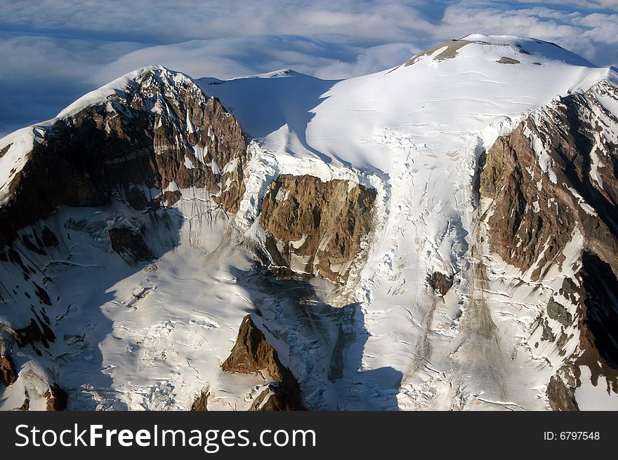 A fly over view of the top of Mount Rainier in the Stae of Washington USA. It was an amazing day, well, above the clouds. A fly over view of the top of Mount Rainier in the Stae of Washington USA. It was an amazing day, well, above the clouds.