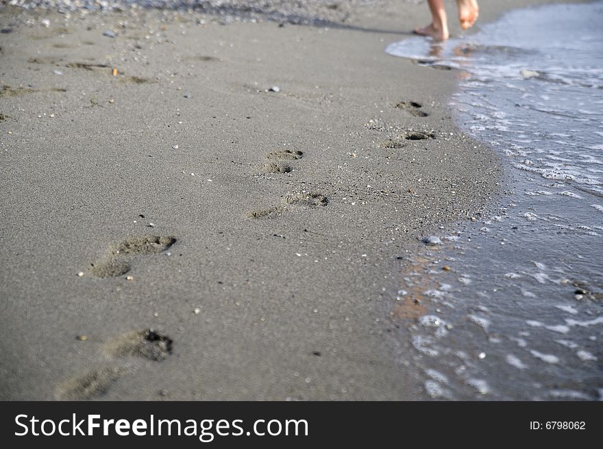 Footprints on sand. good use like background