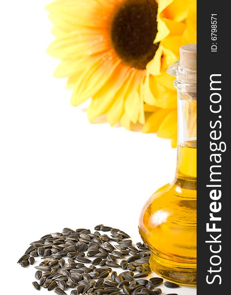 Sunflower and vegetable oil in a bottle on a white background