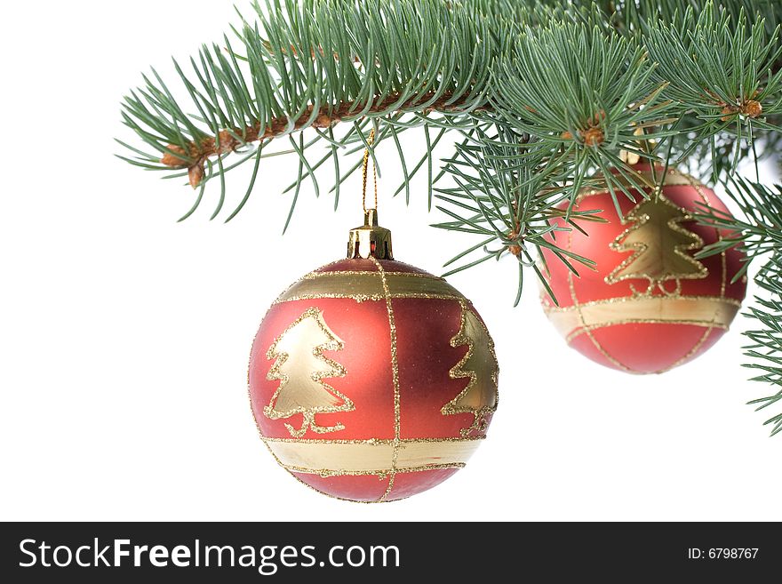 Fir tree branch with decoration on a white background. Close up. Christmas decoration.