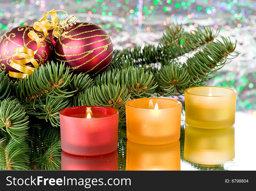 Decoration with an  firtree branch, candles and toys. Decoration with an  firtree branch, candles and toys