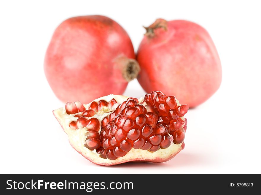 Fresh appetizing pomegranate on a white background. Fresh appetizing pomegranate on a white background