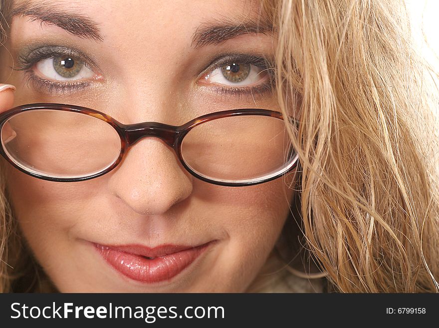 Woman pulling her glasses down - green
