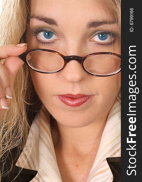 Woman pulling her glasses down - blue eyes