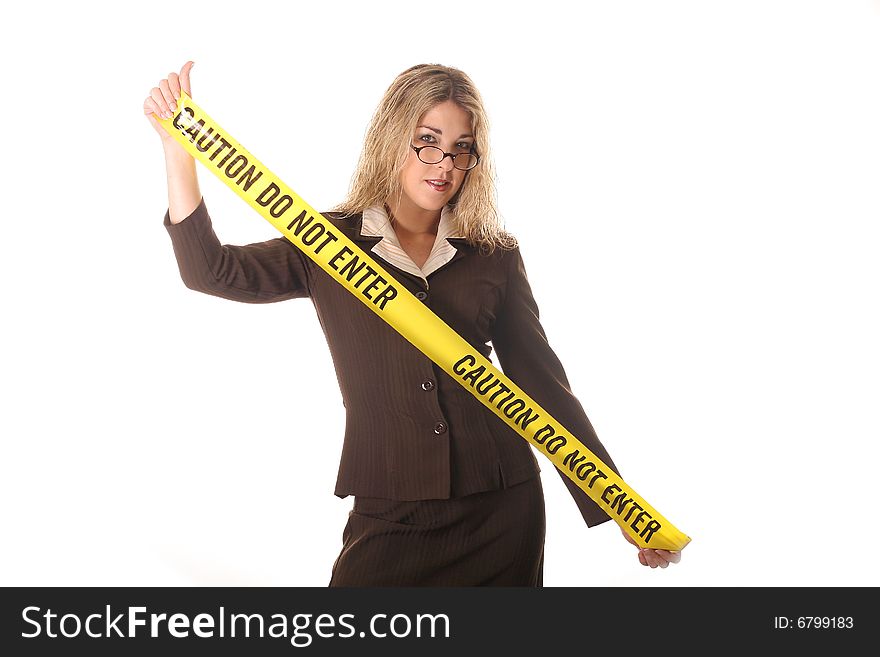 Shot of a sexy woman holding caution tape