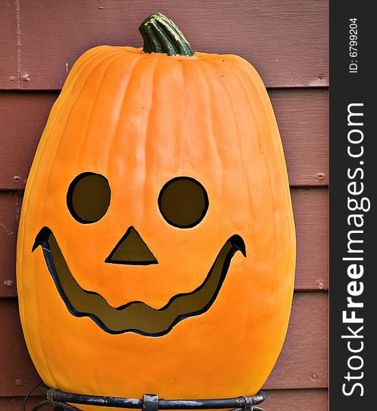 A pumpkin with a happy face waiting for halloween. A pumpkin with a happy face waiting for halloween.