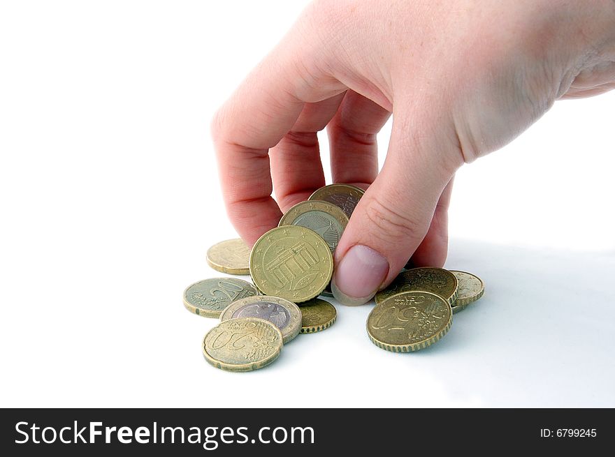 An Isolated image of Euro Coins being picked up. An Isolated image of Euro Coins being picked up