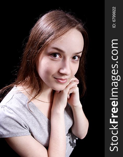 Nice young girl on a black background. Nice young girl on a black background