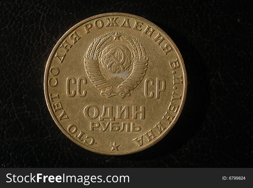 Isolated old soviet ruble against the black background