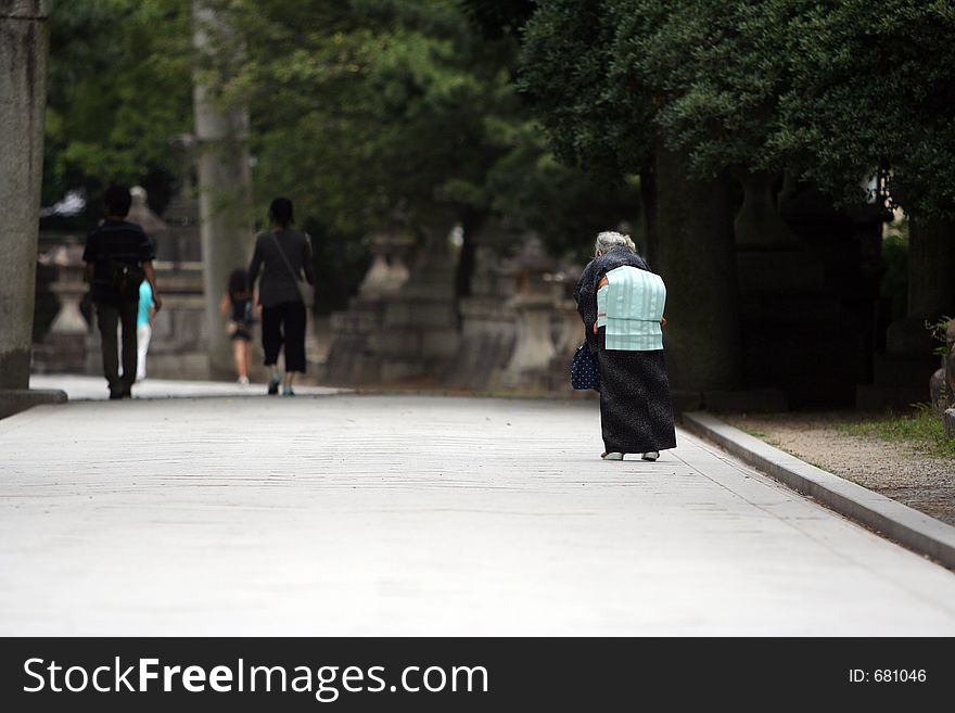 Old lady walking in the street. Old lady walking in the street