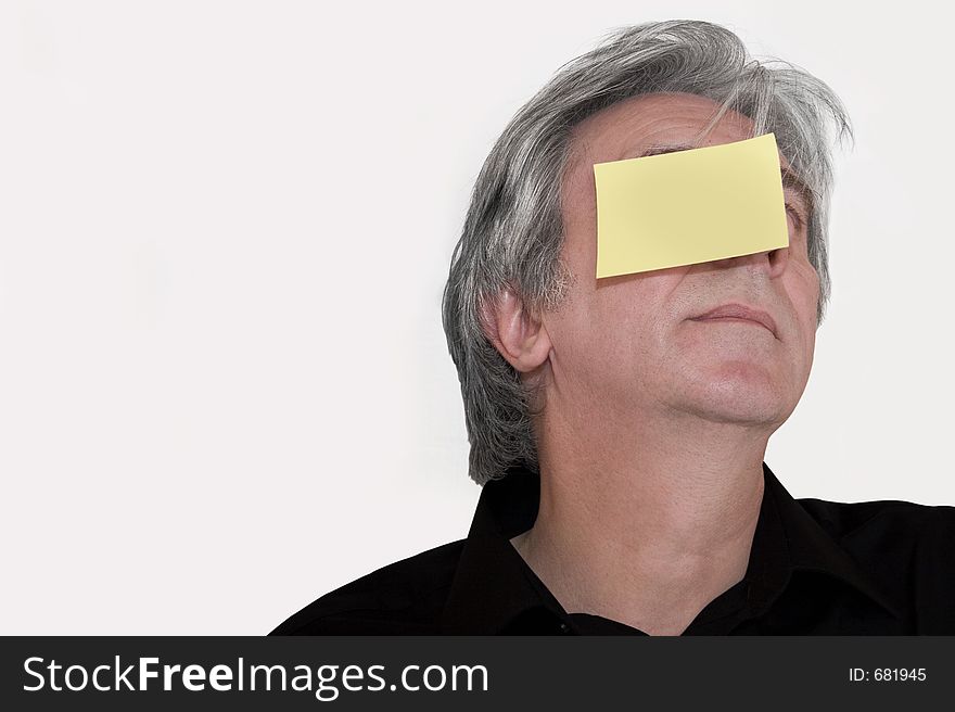 Senior with a yellow piece of paper stuck to his head. Write down whatever you want. Senior with a yellow piece of paper stuck to his head. Write down whatever you want.