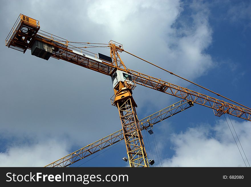 Yellow Crane over the blue sky