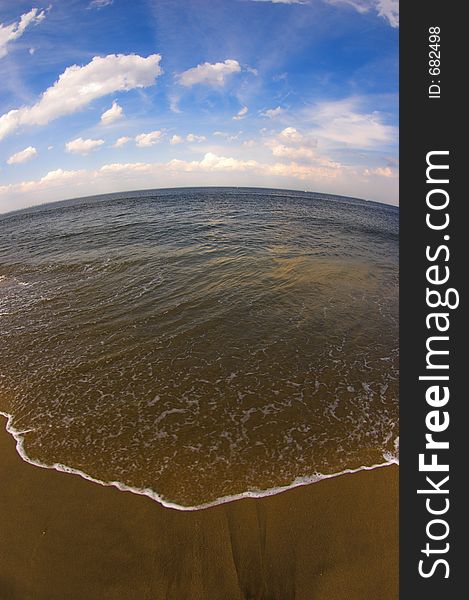 Sea, sky and beach fisheye image