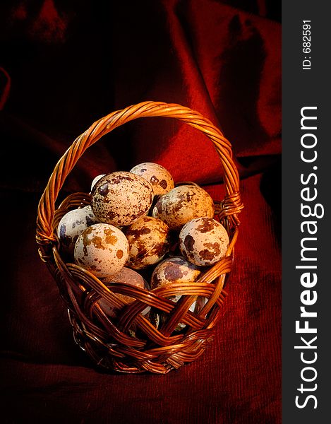 Easter quail eggs in a basket. Easter quail eggs in a basket