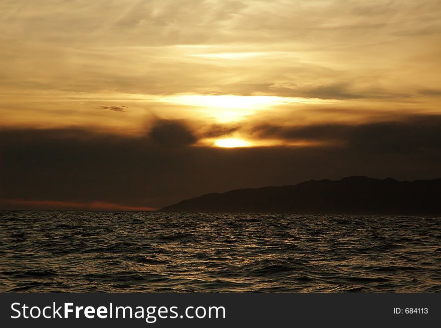 Awesome sunset coloring the ocean and the sky. Awesome sunset coloring the ocean and the sky.