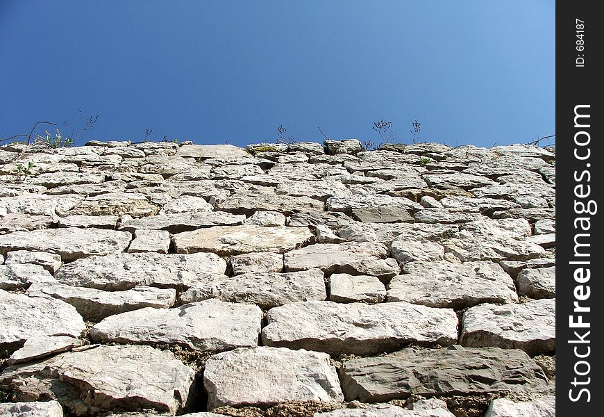 Stone wall and blue sky