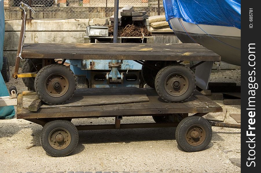 Two old fashioned wooden trolleys one on top of the other. Two old fashioned wooden trolleys one on top of the other.