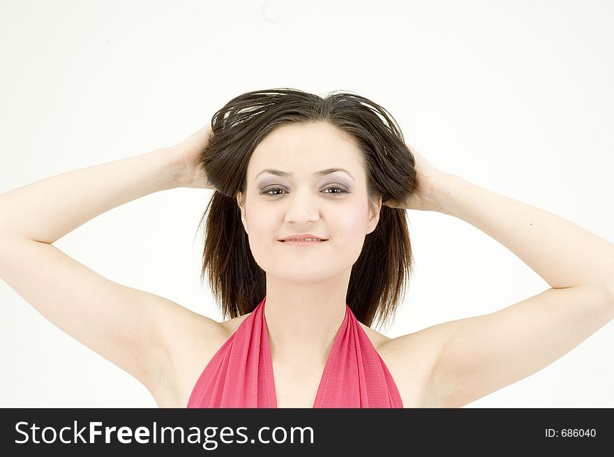 Young woman with the hands in her hair, looking free and wild. Young woman with the hands in her hair, looking free and wild