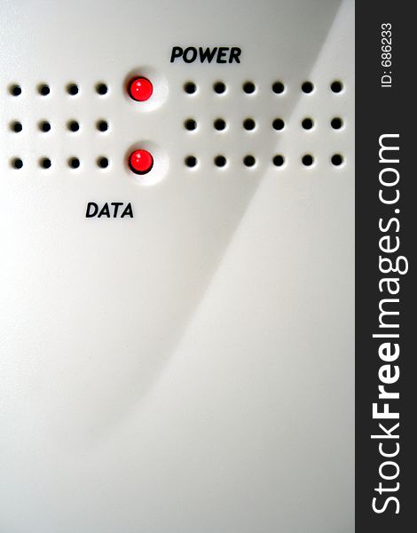 Lights on a modem indicated by power and data with ventilation holes. Lights on a modem indicated by power and data with ventilation holes