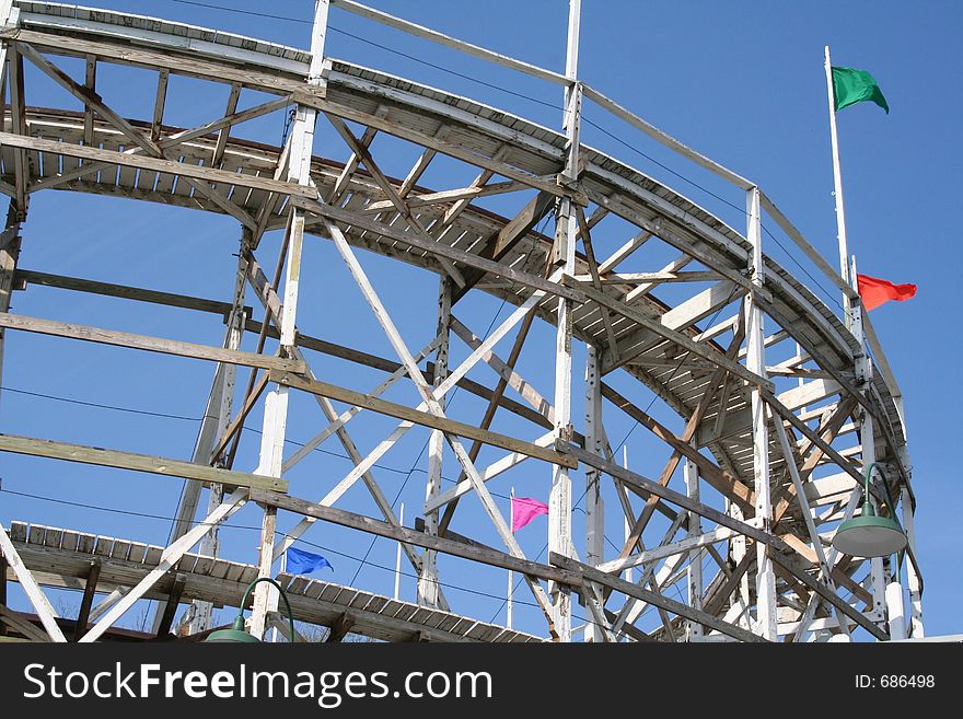 A close-up of a wooden roller coaster. A close-up of a wooden roller coaster