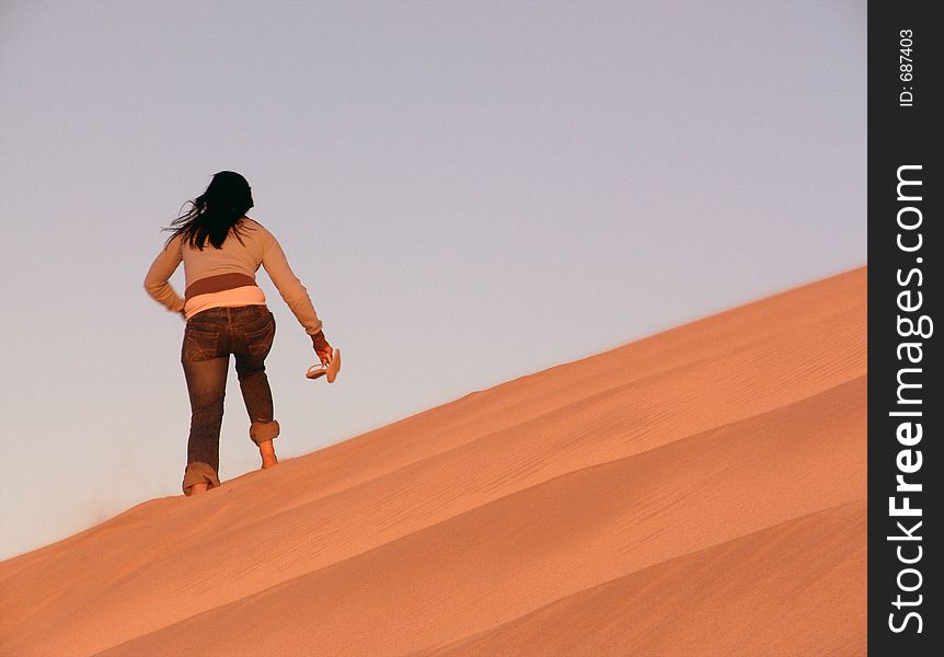 Girl Walking over Dunes. Girl Walking over Dunes