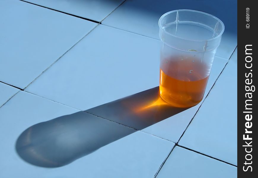 Glass with solution on the laboratory desk.....interesting lighting