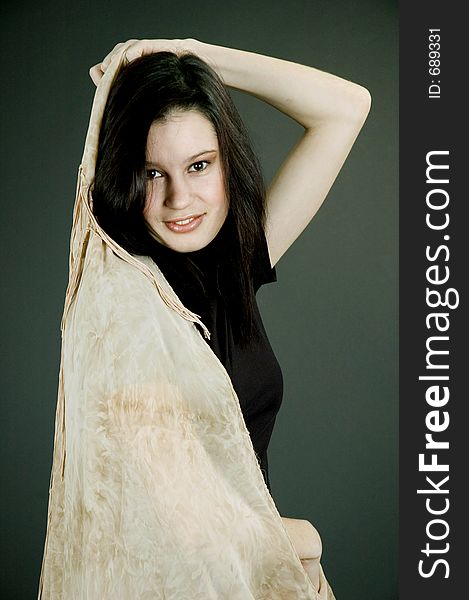 Young woman with silk beige scarf. Young woman with silk beige scarf