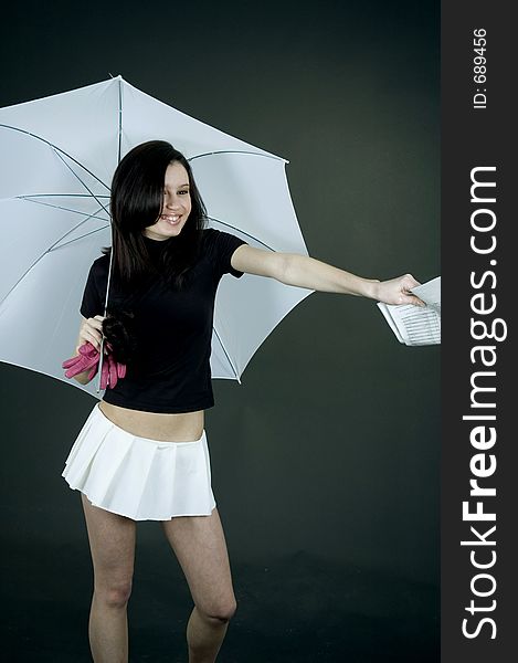 Young woman handing out some papers under a big white umbrella. Young woman handing out some papers under a big white umbrella