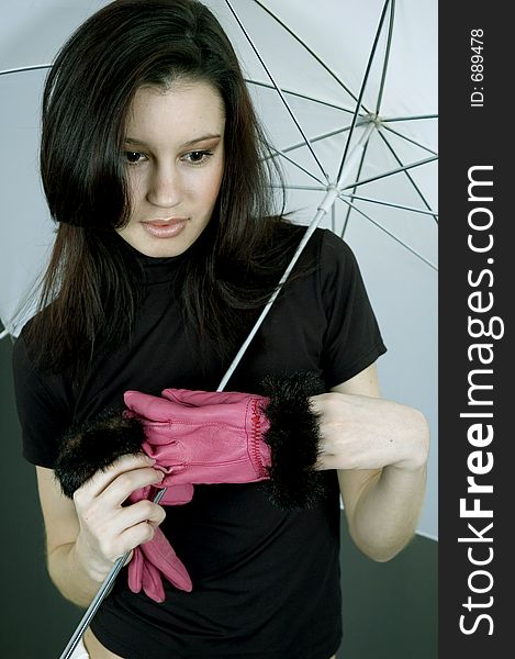 Young woman with purple gloves and white umbrella. Young woman with purple gloves and white umbrella