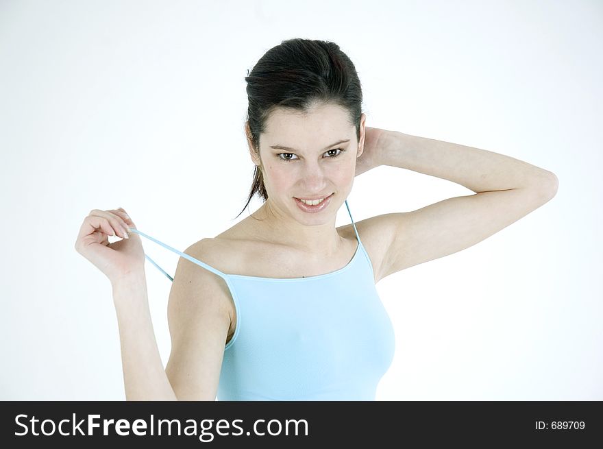 Young woman in blue looking happy. Young woman in blue looking happy