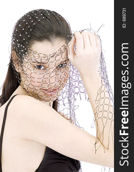 Pretty young brunette with a fresh, fit look, playing with a net shawl over a white studio background, with an expression of purity on her face. Pretty young brunette with a fresh, fit look, playing with a net shawl over a white studio background, with an expression of purity on her face