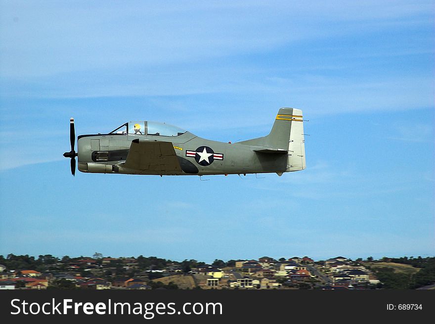 A T28 Trojan plane flies past during an airshow. A T28 Trojan plane flies past during an airshow.