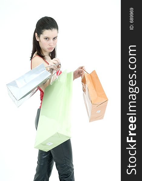 Pretty young woman showing off her shopping bags. Pretty young woman showing off her shopping bags.