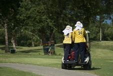 Two Caddies On A Golf Cart Stock Image Two Caddies On A Golf Cart Stock Image