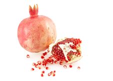 Pomegranate And Scattered Grains. Royalty Free Stock Photography Pomegranate And Scattered Grains. Royalty Free Stock Photography