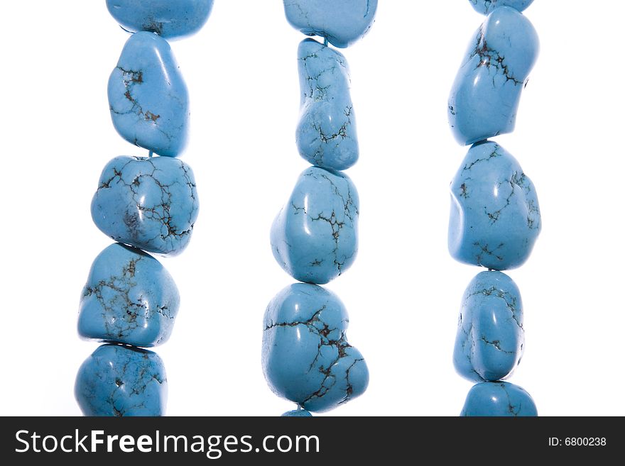 Turquoise beads isolated on white background