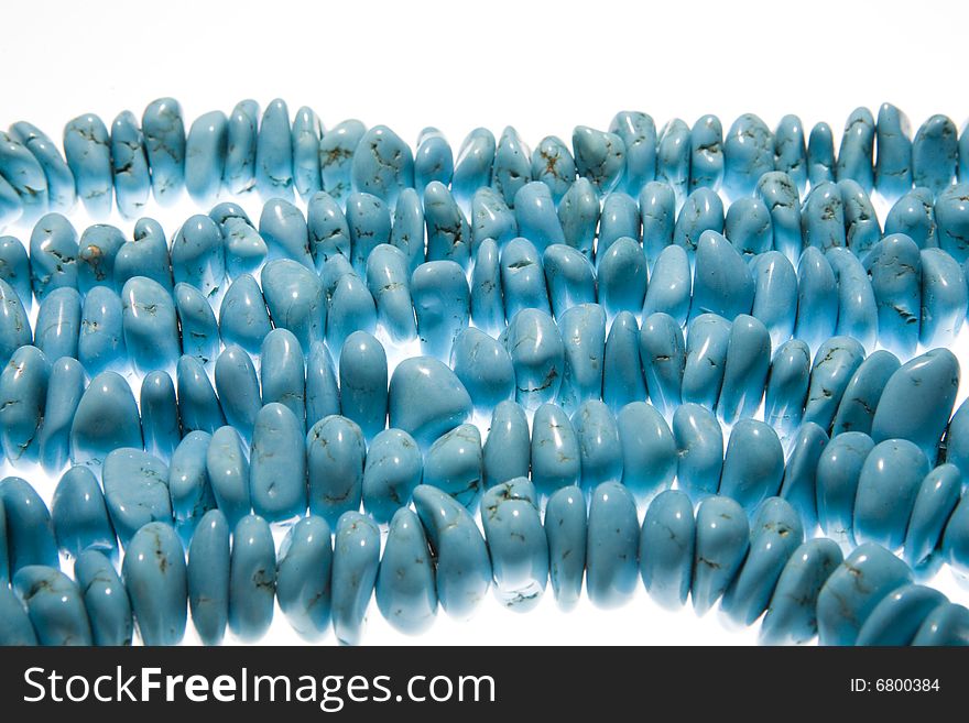 Turquoise beads isolated on white background