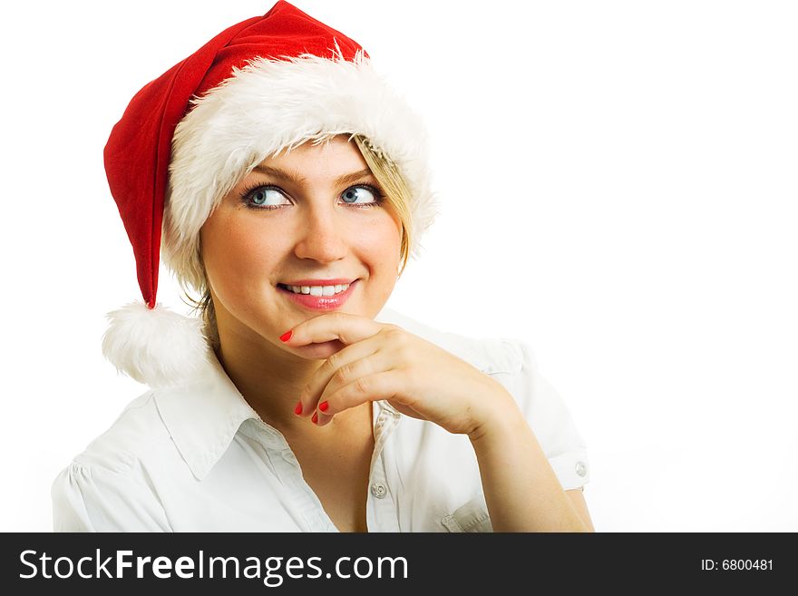 Girl in Santa hat dreaming about.... Isolated on white.