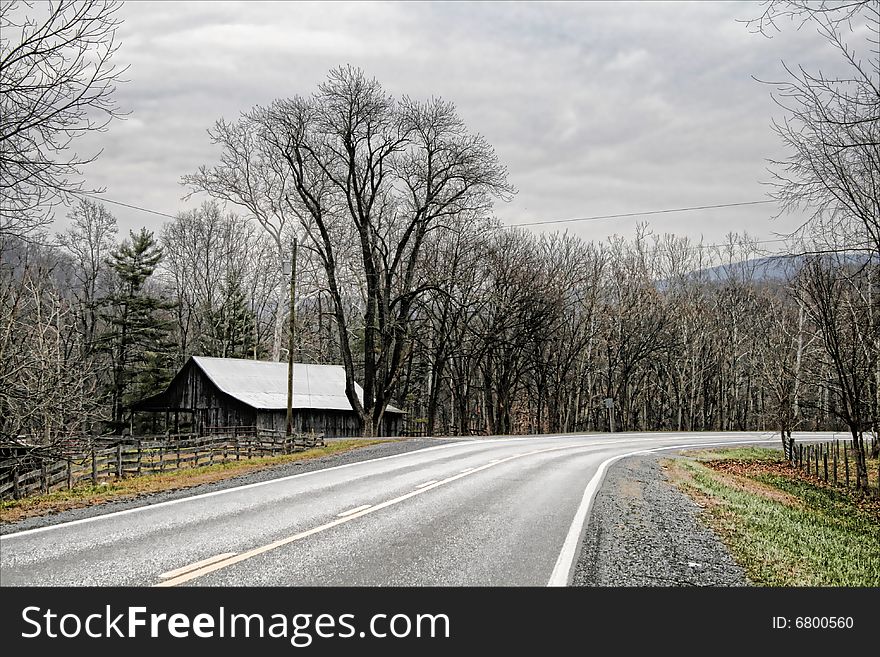 A cold crisp landscape showing the slope of a country road in West Virginia. A cold crisp landscape showing the slope of a country road in West Virginia.