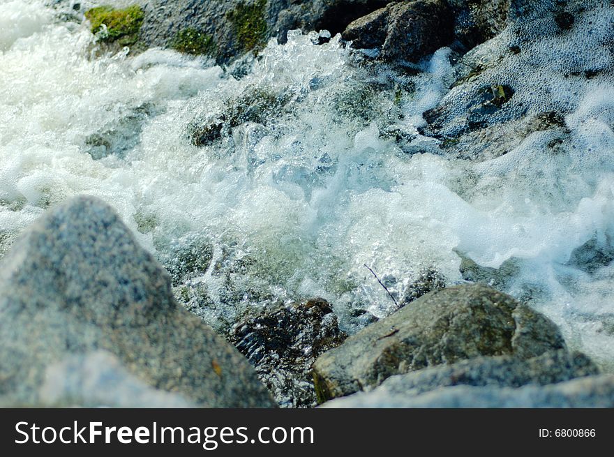 The rapid river and stone