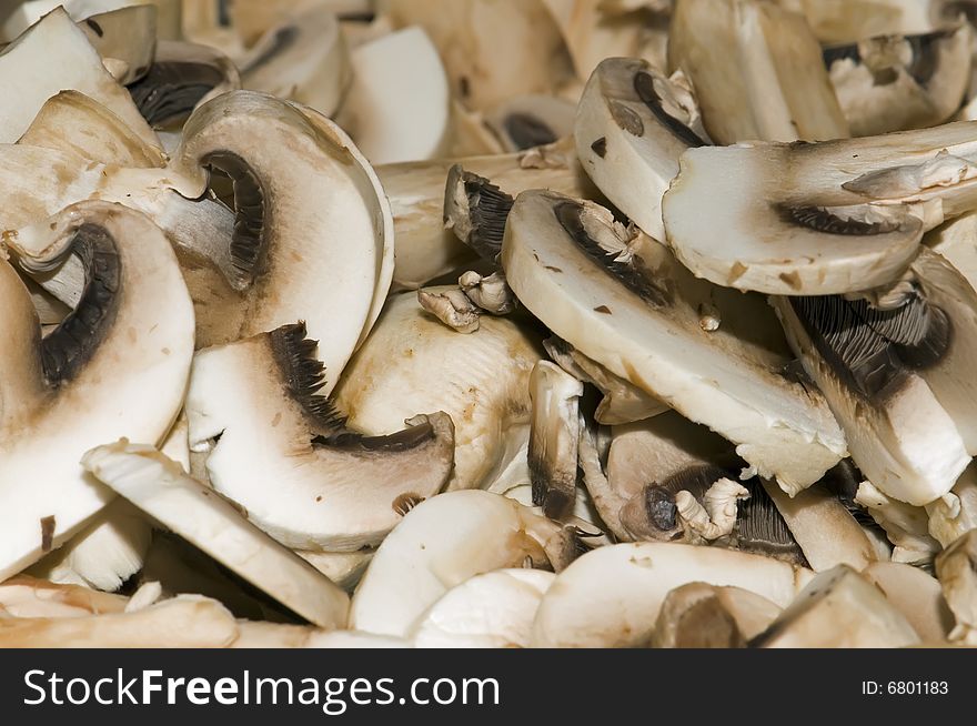 Full frame photo of sliced mushrooms close up. Full frame photo of sliced mushrooms close up.