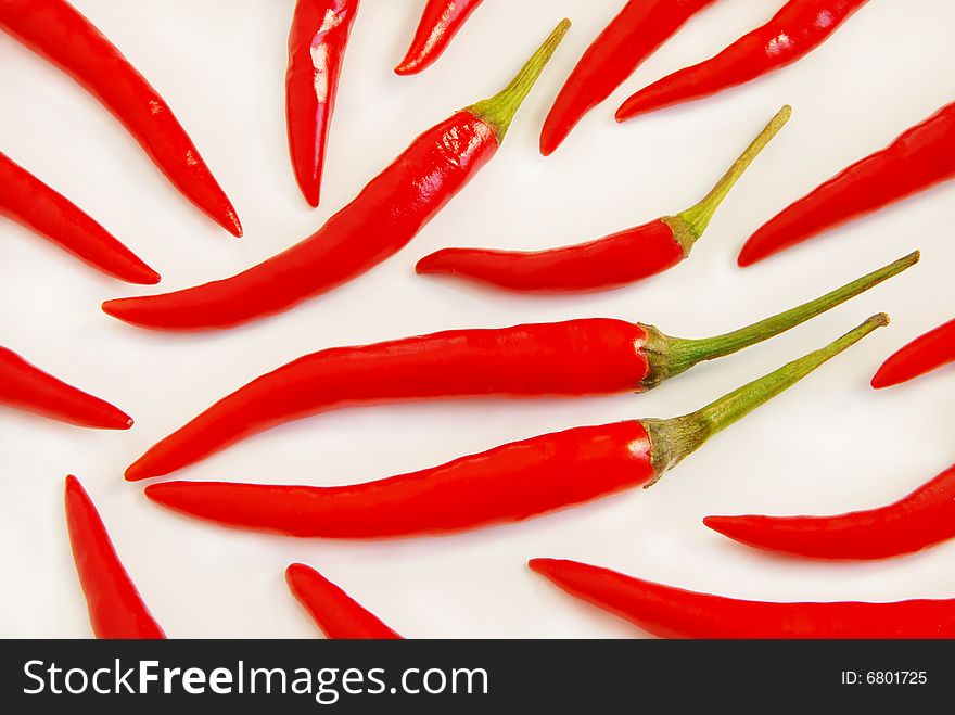 Red hot chili peppers on a white background